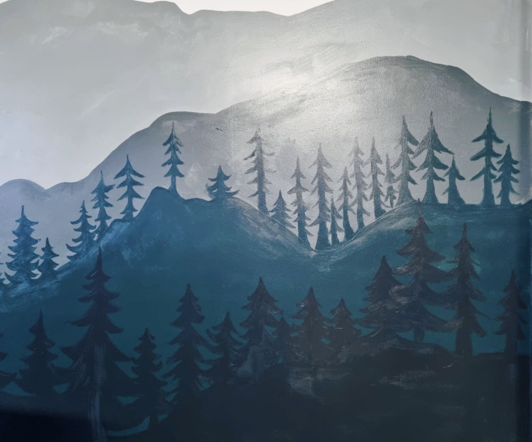 Mural of mountains for the MBBCA school venue, painted on an inset wall of the multipurpose hall.