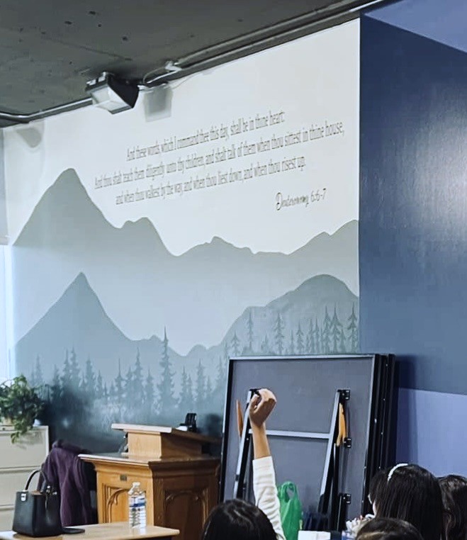 Mural of mountains for the MBBCA school venue, painted on an inset wall of the multipurpose hall.