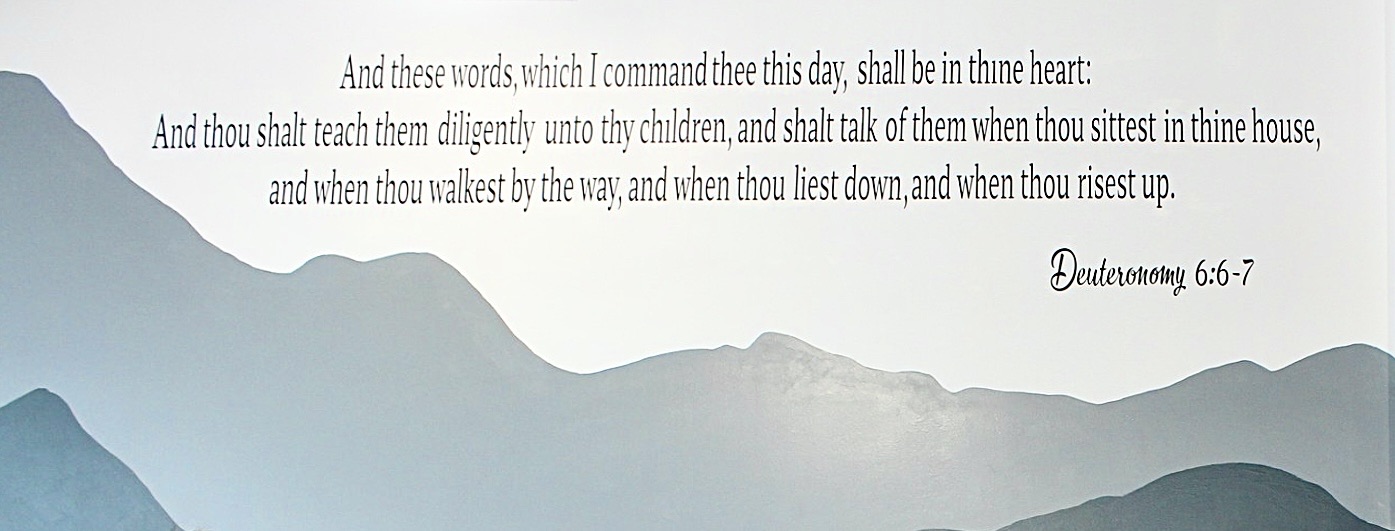 Mural of mountains for the MBBCA school venue, painted on an inset wall of the multipurpose hall.