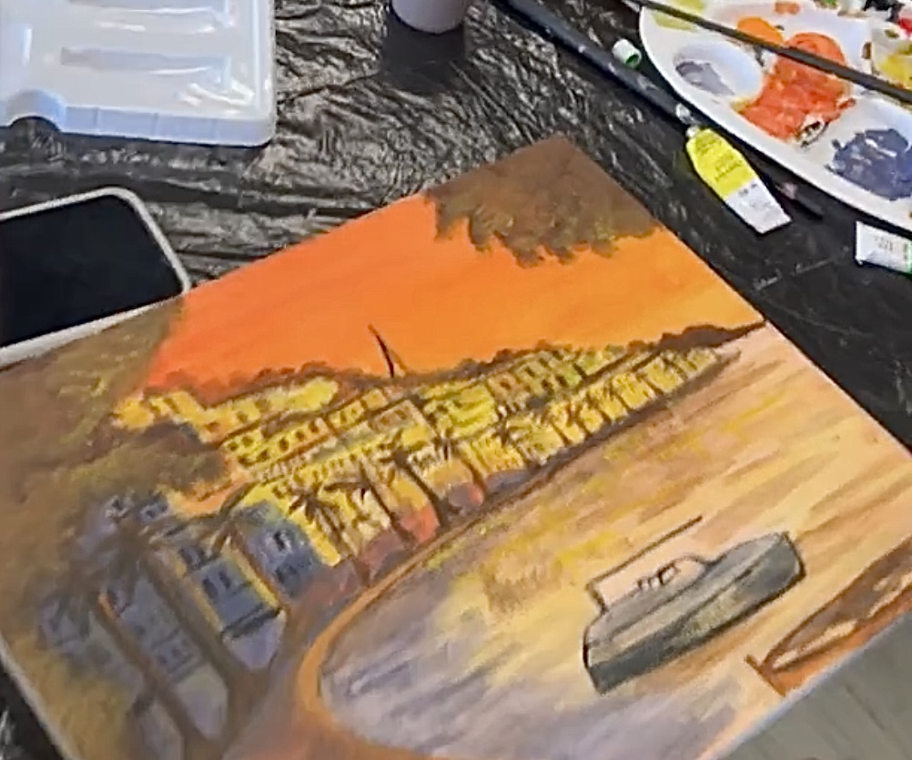 Painting of a coastal city and a boat bathed in sunset hues in progress.