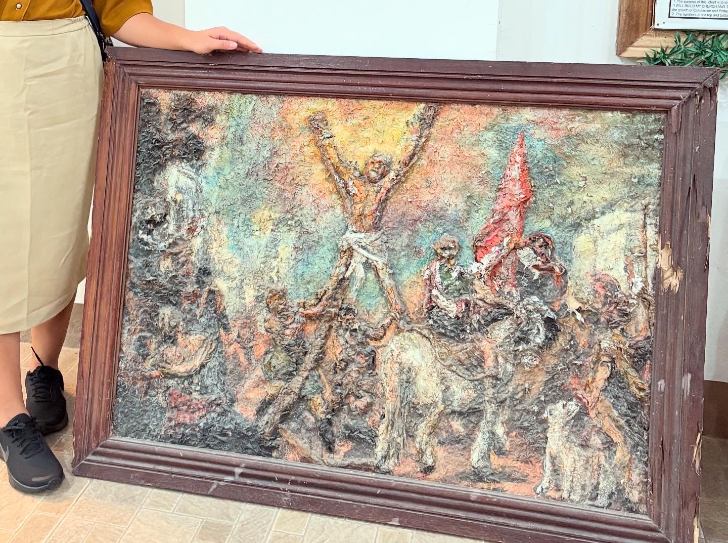 A depiction of Andrew the Christian disciple bound in two poles of the shape of an X against a fiery skyline, surrounded by masses of onlookers and animals.