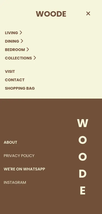 A screenshot of the Woode mobile navigation overlay featuring a stylish split-color layout. The top section, on a cream background, lists primary categories like 'Living', 'Dining', and 'Bedroom' with chevron icons indicating submenus, followed by utility links like 'Shopping Bag'. The bottom section, in dark brown, highlights institutional links such as 'About' and 'We're on WhatsApp', accented by large, artistic vertical typography spelling 'WOODE' on the right.
