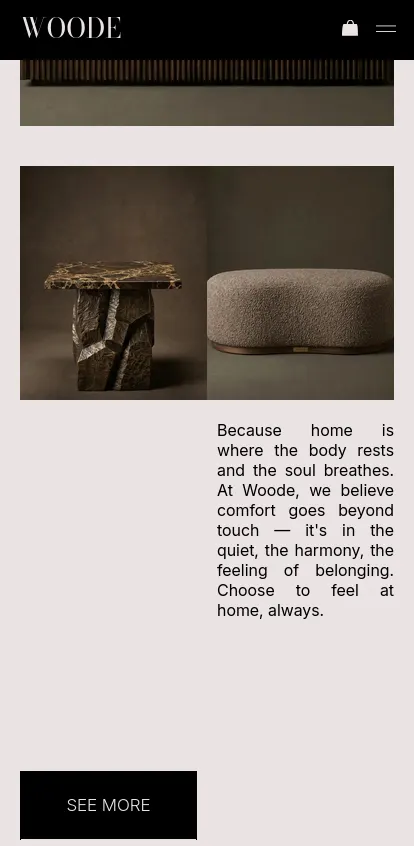 A mobile layout for 'The Edit' section featuring a side-by-side editorial image: on the left, a striking accent table with a chiseled stone base and dark marble top; on the right, a soft, textured pill-shaped ottoman. Below the imagery, poetic brand copy about comfort and harmony rests in negative space, anchored by a sleek black 'SEE MORE' button, maintaining a refined, museum-like elegance.