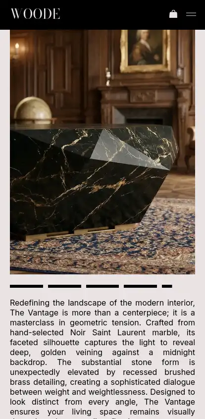 A mobile product page for 'The Vantage'. A striking photograph showcases the table's bold, faceted black marble form and deep golden veining, contrasting beautifully against a classic, wood-paneled room and patterned rug. Below the image, sleek carousel indicators sit above detailed, museum-style descriptive copy that highlights the piece's 'geometric tension' and 'Noir Saint Laurent marble'