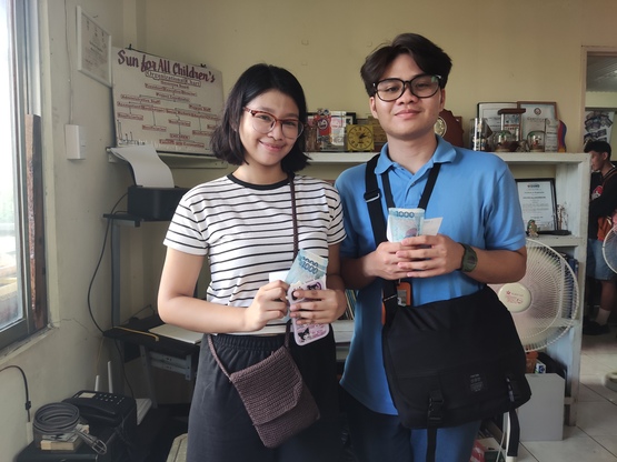 Hexenne & Danielle are all smiles after receiving their cash.