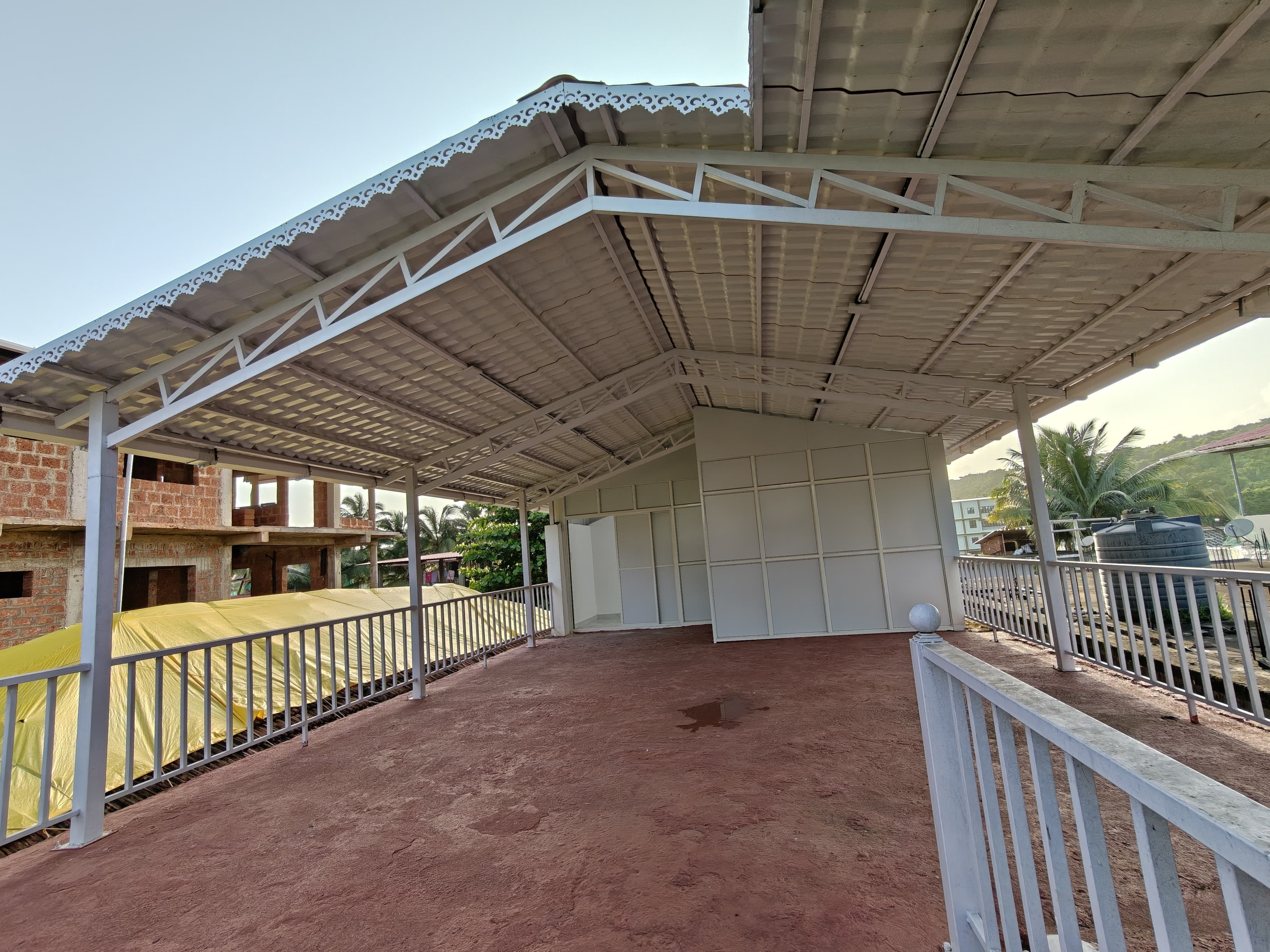 Two large shaded verandas across the ground and upper floors of the ANANTA villa