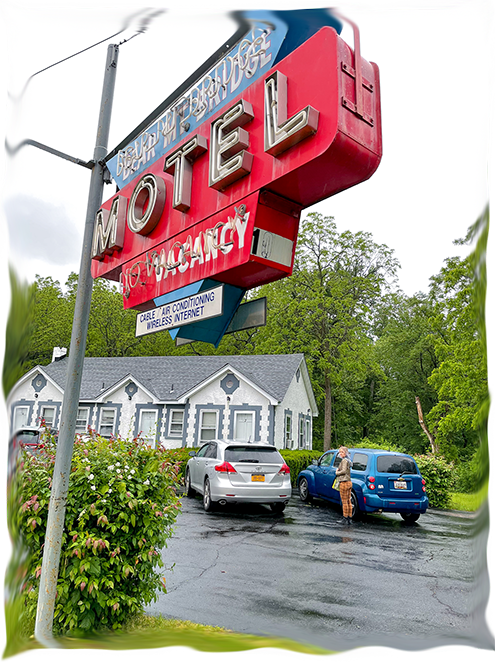 photo of motel and Elyza filming Testify