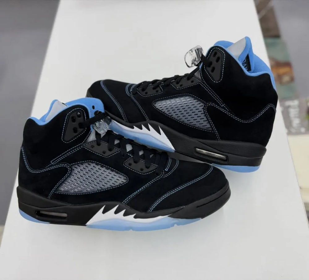 Air Jordan 5 Black University Blue 2026 heel detail with UNC blue embroidery and 3M tongue