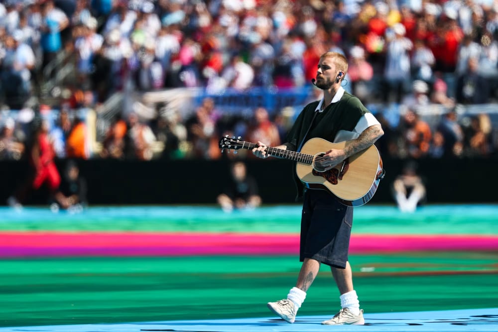 Justin Bieber performing at the 2026 World Cup final halftime show in SKYLRK Matterdaddies Latte sneakers