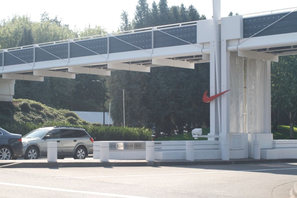 Nike world headquarters entrance at One Bowerman Drive, Beaverton, with the Swoosh on the gate, the model for Nike's new Bengaluru campus