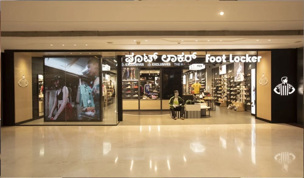 Foot Locker Bengaluru store at Nexus Mall with Kannada and English signage, opened December 2025