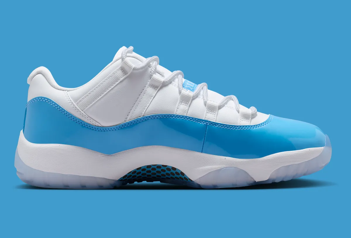 Air Jordan 11 Low University Blue 2026 side profile showing Carolina blue patent leather mudguard and icy sole