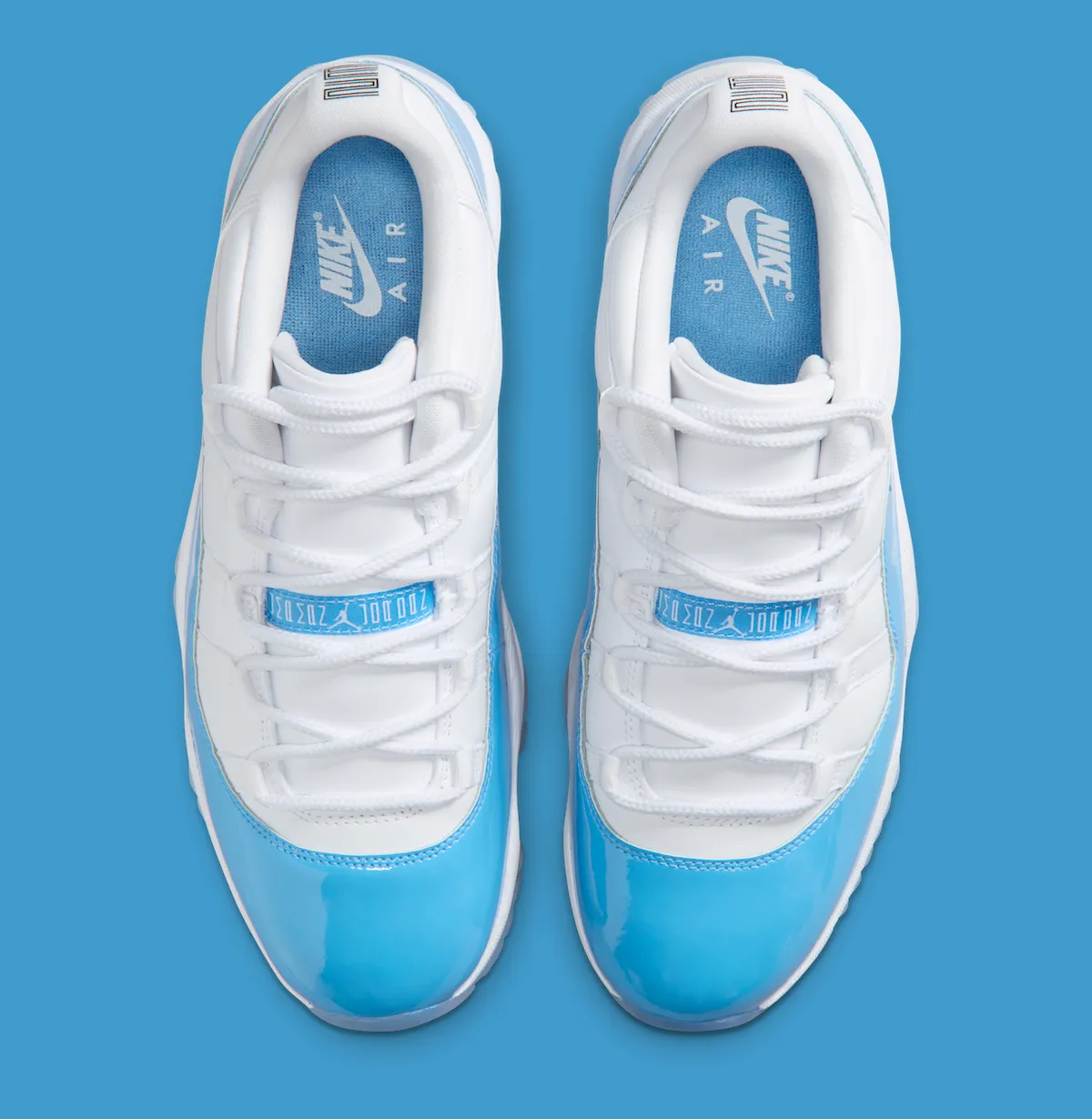 Air Jordan 11 Low University Blue 2026 top down view showing white mesh and lace detailing