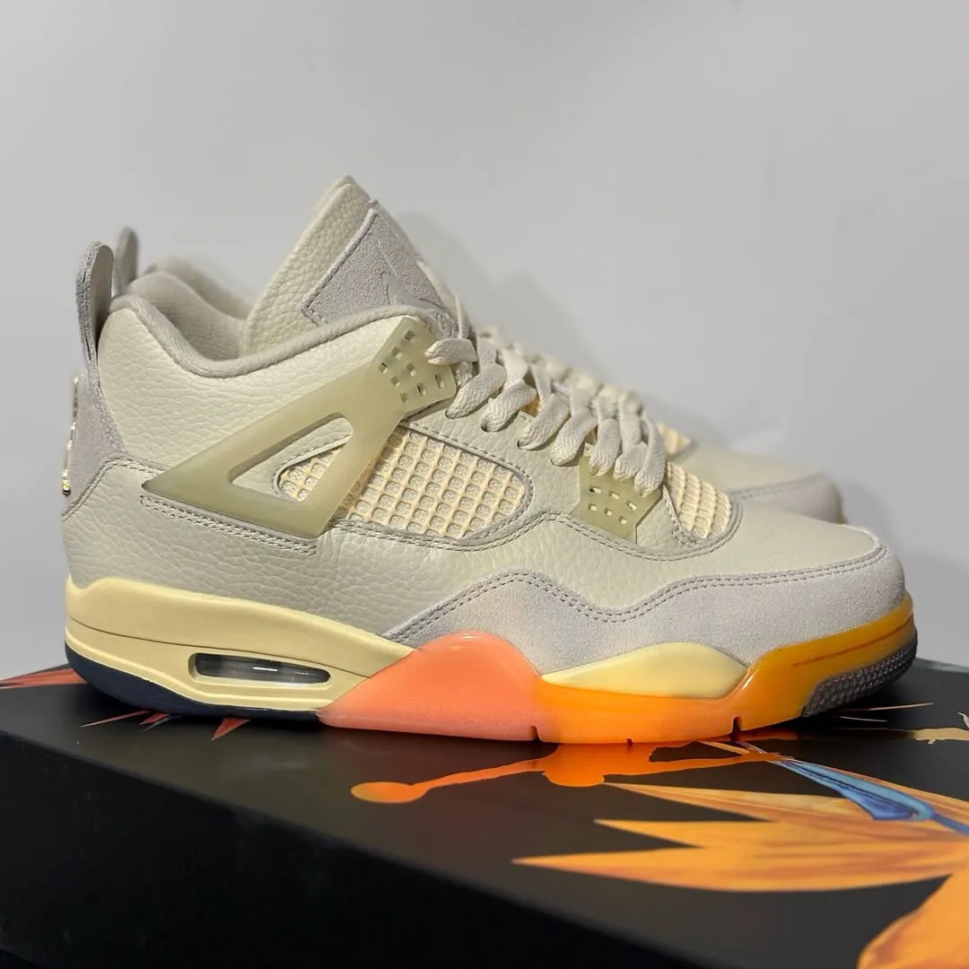 Air Jordan 4 Birds of Paradise sole view showing Bright Mango and Sundial translucent outsole detail