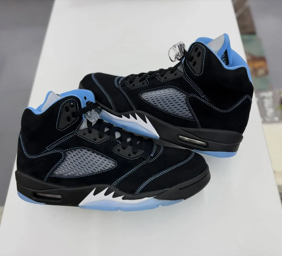 Air Jordan 5 Black University Blue 2026 heel detail with UNC blue embroidery and 3M tongue
