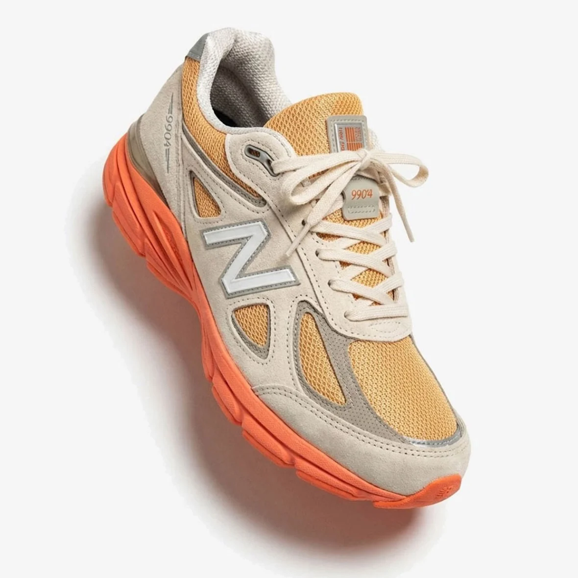New Balance 990v4 U990MO4 Moonbeam Tangerine Heat Made in USA sole and suede detail shot 2026