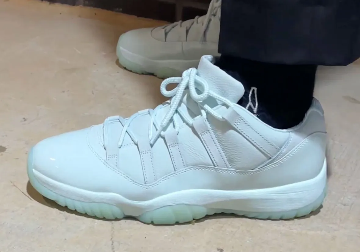 JAIDE x Air Jordan 11 Low Fiberglass heel tab detail showing JAIDE and 23 split branding 2026
