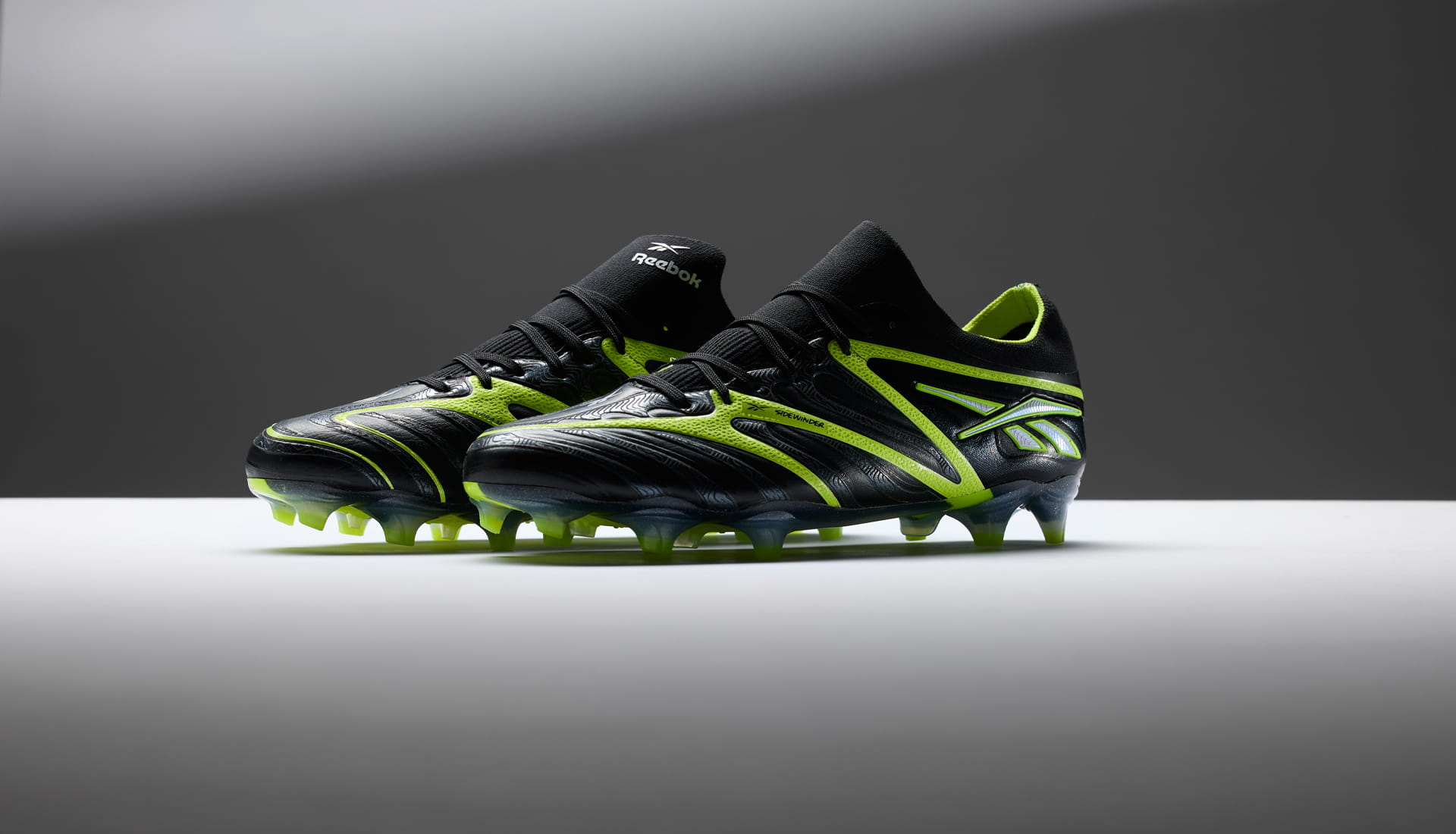 Reebok Sidewinder sole and upper detail — Pebax plate, Supra Skin texture, World Cup 2026 football boot