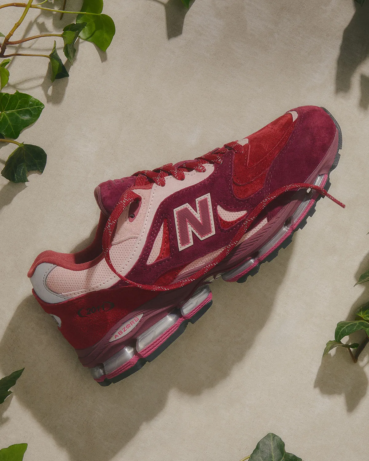 Kith x New Balance 2011 Sakura Flower pink suede leather mesh construction close-up 2026