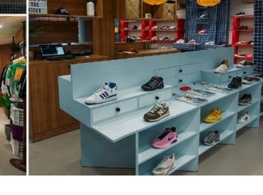Superkicks GK-II display tables with Jordan, adidas, and Nike sneakers arranged for browsing