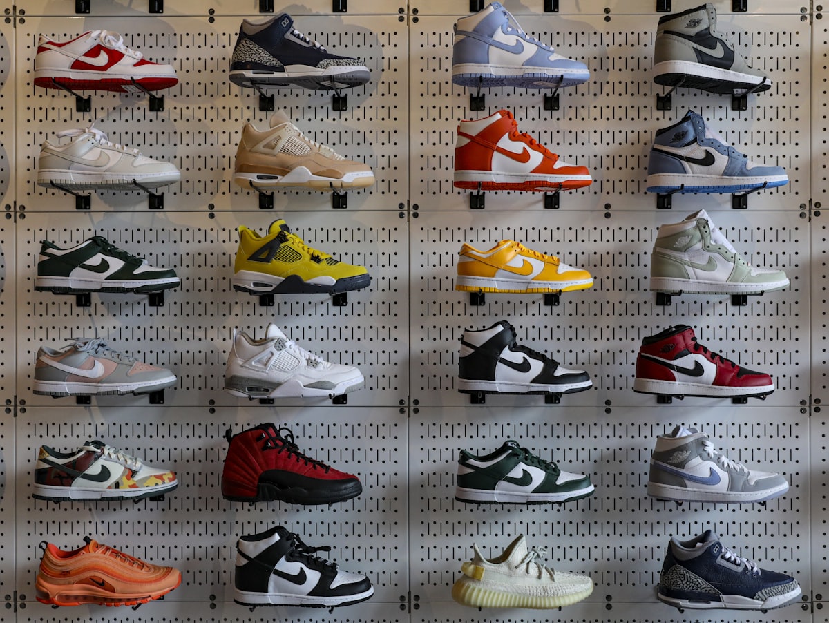 Wall display of sneakers in a retail store representing imported footwear stock India