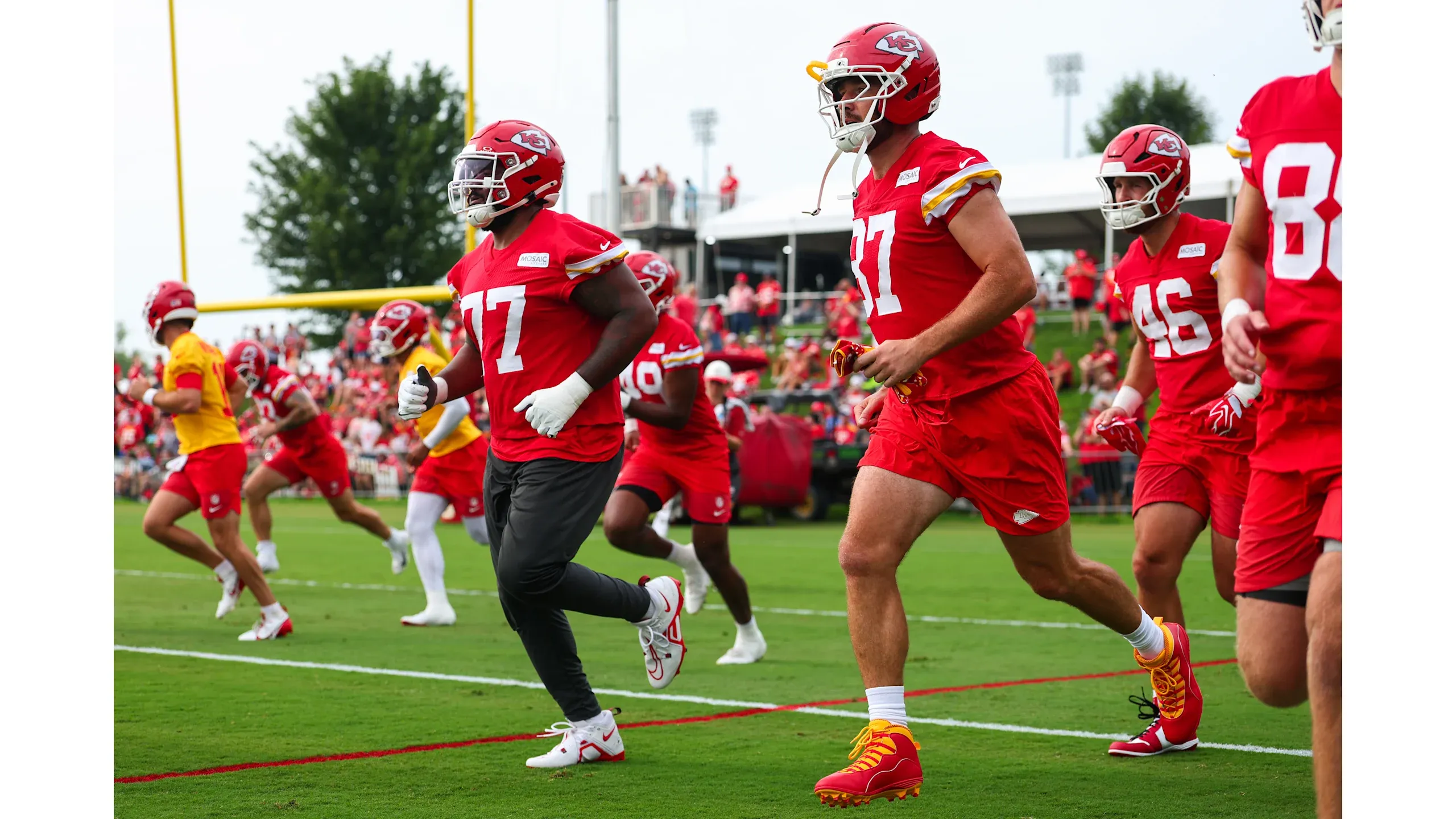 Travis Kelce wearing Air Jordan 10 Chiefs PE cleats at Kansas City Chiefs training camp July 2026