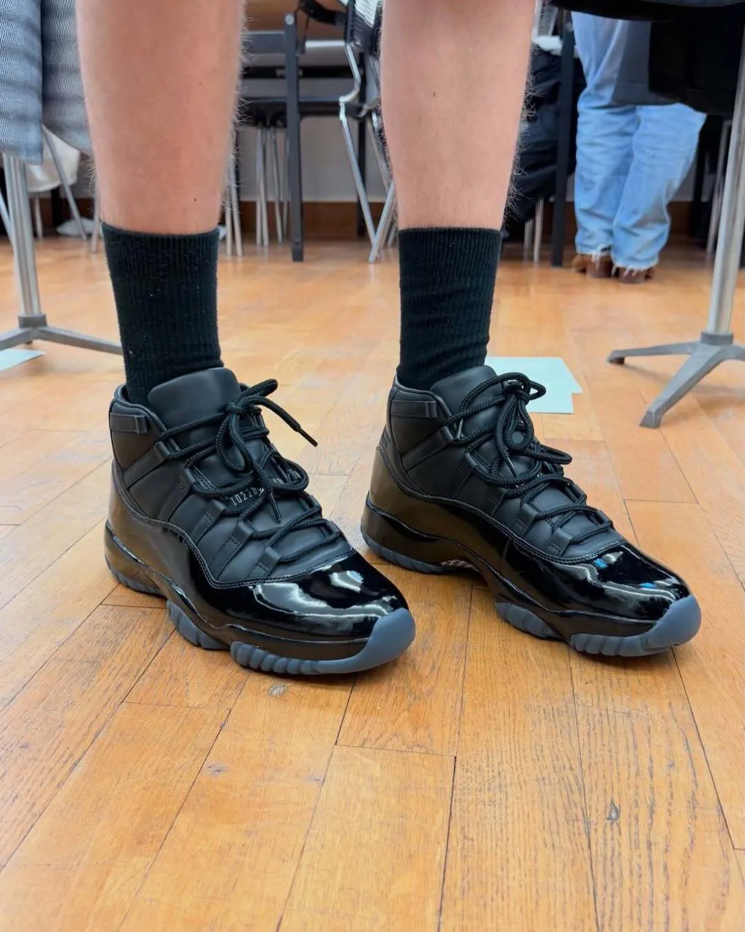 COMME des GARÇONS Homme Plus Air Jordan 11 on feet with black tailored trousers Paris Fashion Week 2026