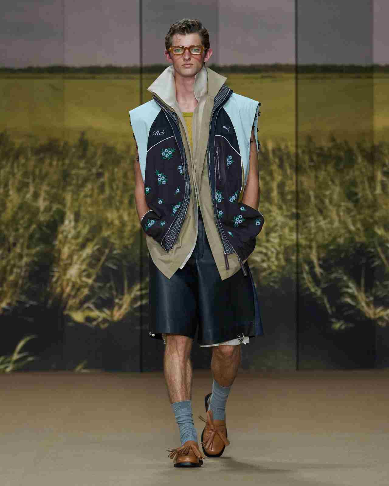 Dhruv Kapoor Presence SS27 Milan runway look featuring PUMA x RCB reworked cricket jacket detail