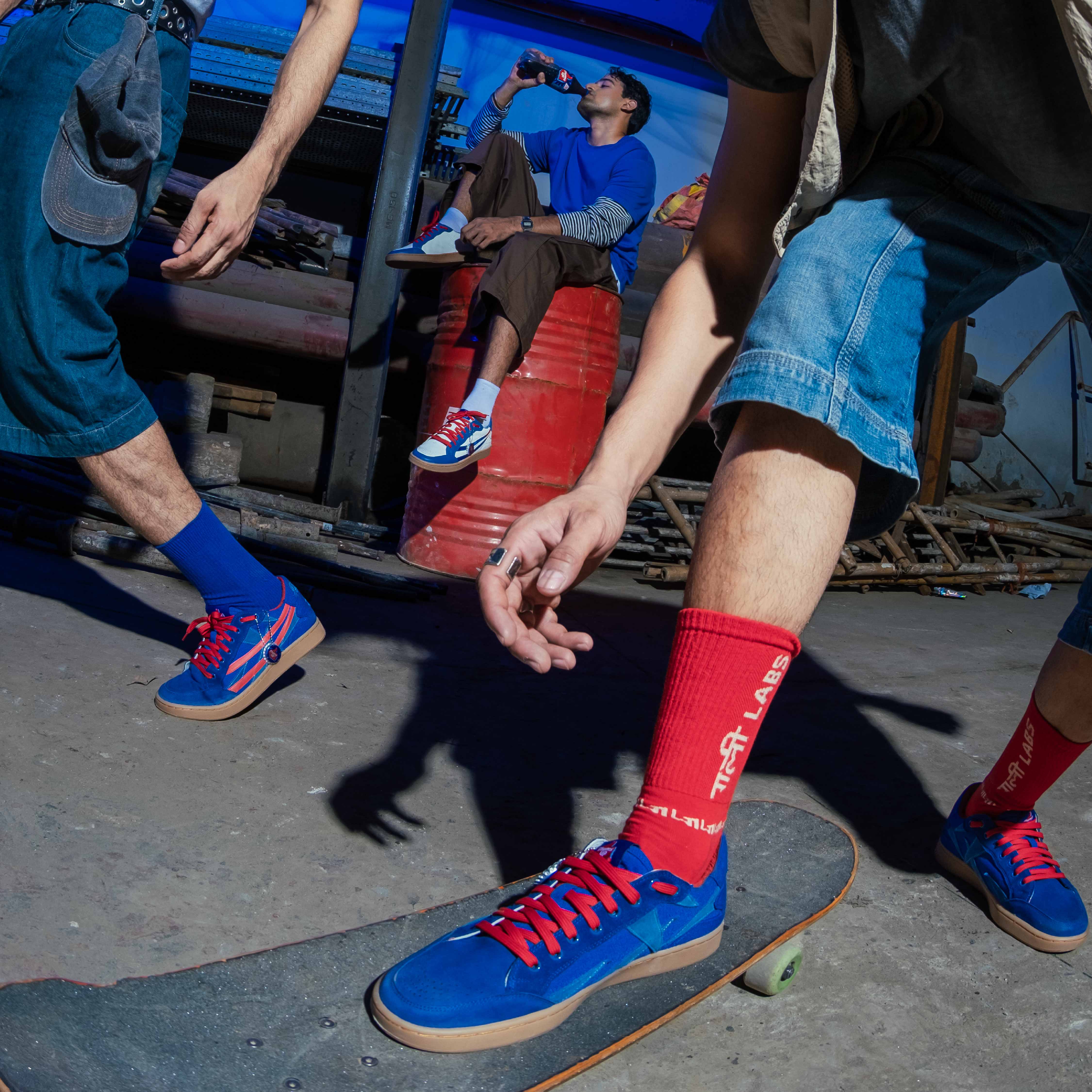 Thums Up x Gully Labs Toofani Blue sneaker side profile showing red synthetic leather Baaz trail and natural rubber sole