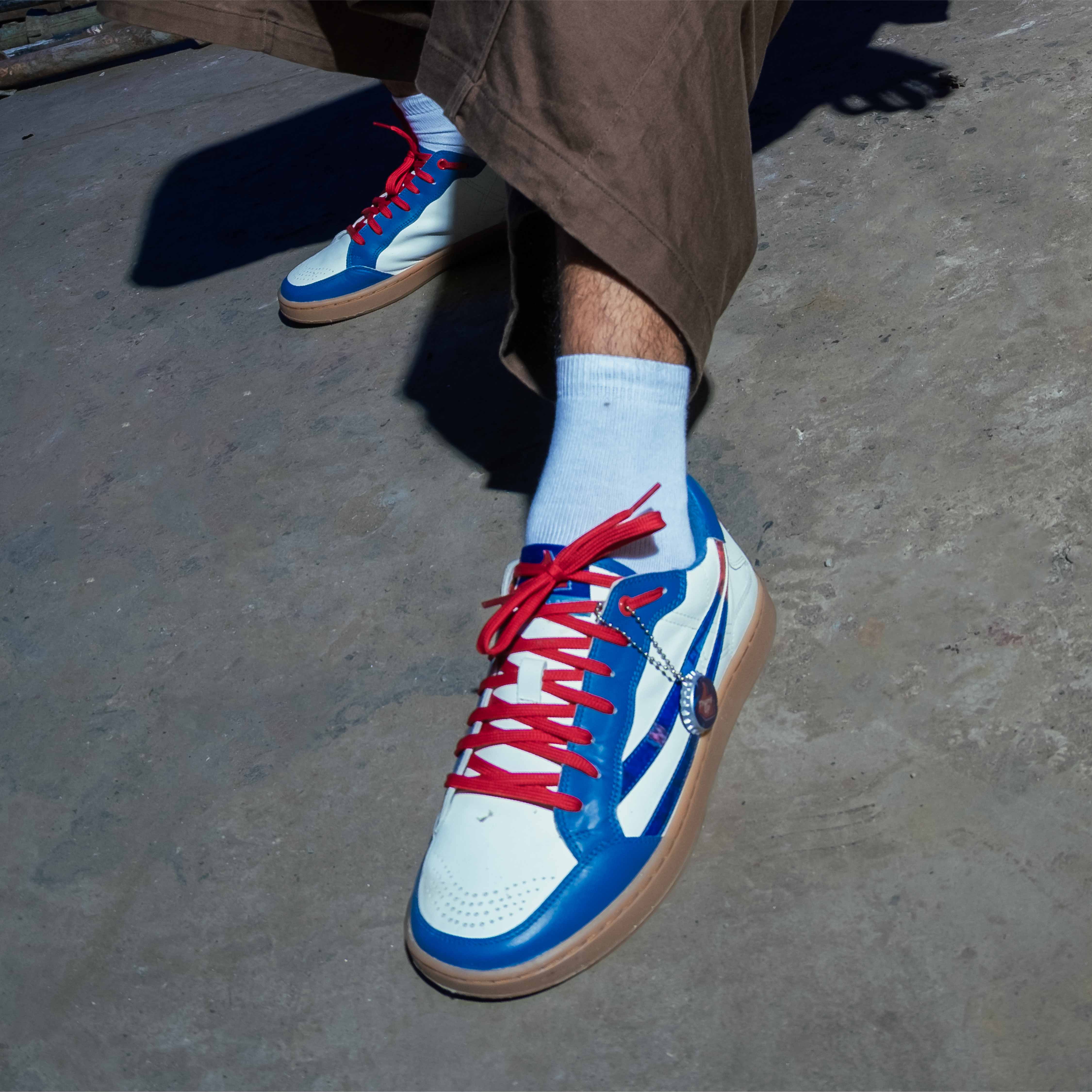 Thums Up x Gully Labs Thunder White Gully Number 001 sneaker front angle with Baaz embroidery on the back tab