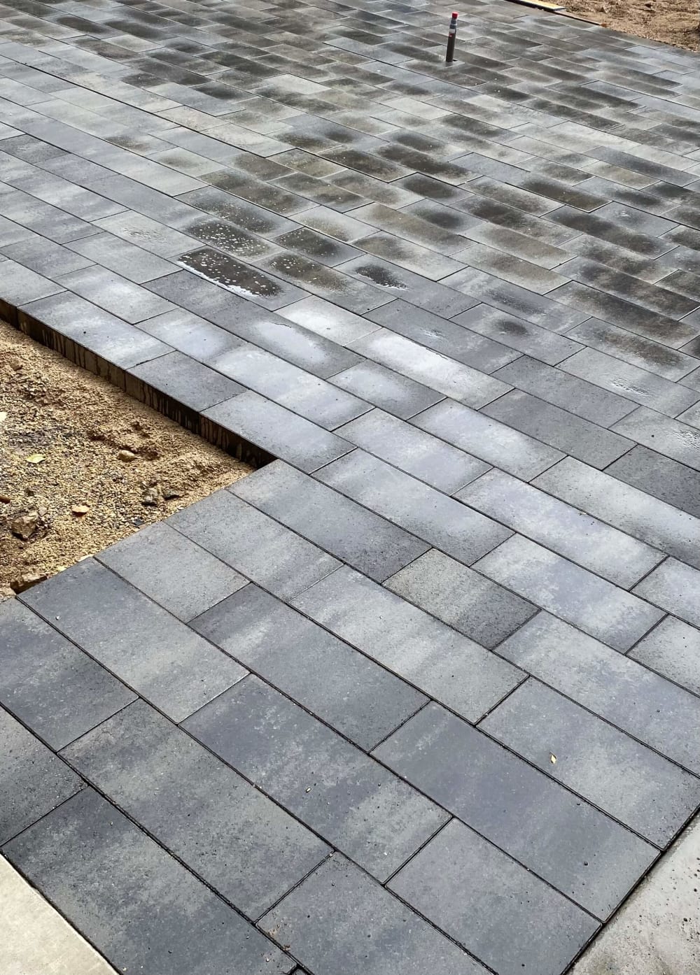 Close view of neatly aligned gray rectangular pavers
