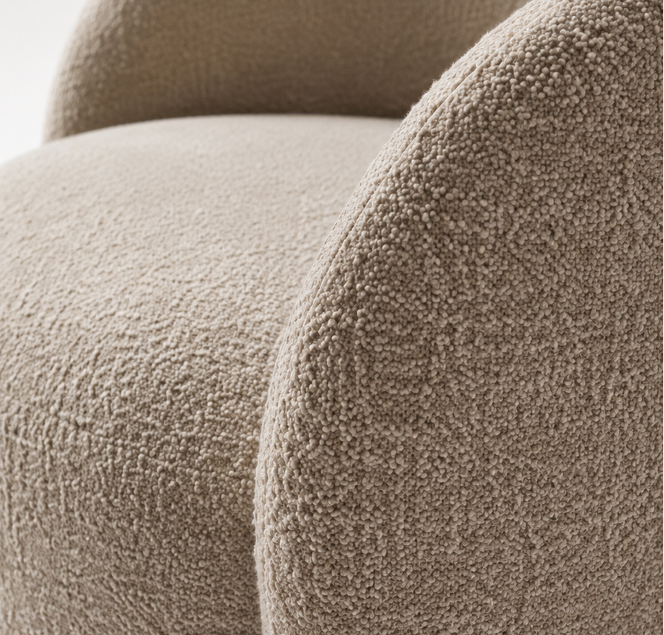 CALVENA luxury curved lounge chair with warm ivory textured upholstery, integrated arms and sculptural upholstered base — view 5
