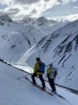 Who Are These Courses For? feature image - Ski mountaineers navigating in the backcountry