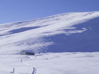 Winter Adventures for Every Explorer feature image - Rex Simpson Hut in the Two Thumb Range is a great base for winter adventures.