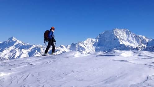 Explore the backcountry Cass Valley | Ski touring, split-boarding, snowshoeing and hiking adventures - Ski tourer on a ridge above the Cass Valley with Aoraki Mount Cook and the Southern Alps in the background 1