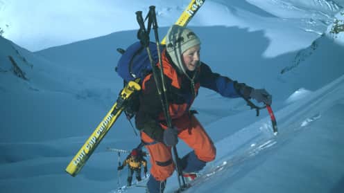  Above Worry Level | Mid-winter ascents of Elie de Beaumont and Mount Tasman - Ski mountaineers carry skis on packs, climbing Elie de Beaumont in Aoraki Mount Cook National Park 1