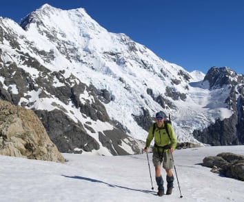 New Zealand Alpine Treks & Hikes - Aoraki Mount Cook Trek - Trekker on Ball Ridge in front of Caroline Face 4