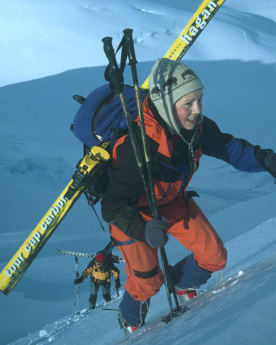 Articles - Above Worry Level - Ski mountaineers carry skis on packs, climbing Elie de Beaumont in Aoraki Mount Cook National Park