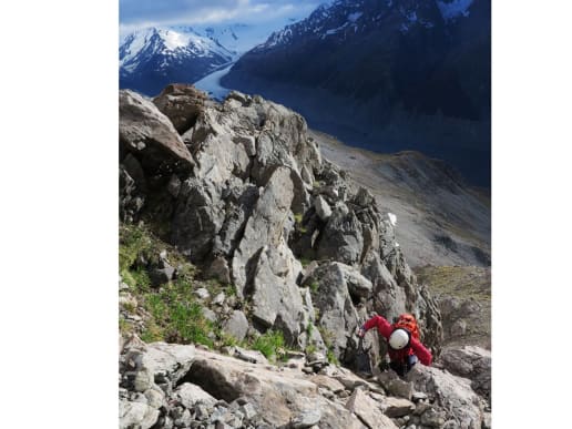About - Preparing for your Mountain Adventure - Routes to and from Caroline Hut and Ball Ridge - Climbing up steep alpine terrain near Caroline Hut - Hiker scrambling up steep rocky terrain on Ball Ridge, Ball Pass, Aoraki Mount Cook National Park 5