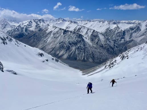 New Zealand Backcountry Skiing & Split-boarding - The Best Freeride, Ski Touring & Split-Boarding Adventures in New Zealand - Cass Valley Ski & Split-board Tours - Ski touring through fresh powder snow high above the Cass Valley - Ski tourers skinning up slope in fresh snow, Cass Valley, Lake Tekapo