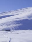 Learn Skills in Great Terrain feature image - Rex Simpson Hut in the Two Thumb Range is a great base for backcountry ski and splitboard courses