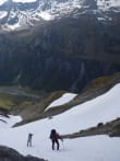 Highlights of Our Track & Raft Trips feature image - Crossing snow slopes near Brodrick Pass