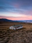 Accommodation feature image - Sunset over Rex Simpson Hut (photo: K. Bowie)