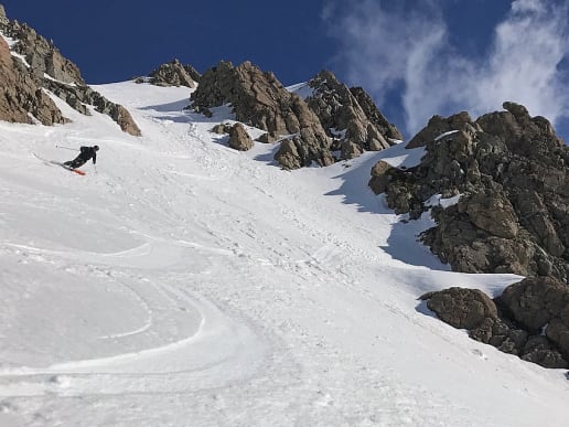 New Zealand Backcountry Skiing & Split-boarding - New Zealand's Best Glacier Touring & Ski Mountaineering - Ski Mount Cook Range - Steep, unforgiving terrain requires expert ski ability and confidence in variable snow conditions - Skiing down a steep couloir near Caroline Hut, Aoraki Mount Cook National Park 7