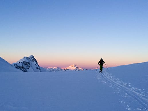 New Zealand Backcountry Skiing & Split-boarding - New Zealand Ski Traverses & Backcountry Expeditions - Symphony on Skis - Sunset on Tasman Saddle, Aoraki Mount Cook National Park - Ski tourer silhouetted against the sunset on Tasman Saddle, Aoraki Mount Cook National Park 3