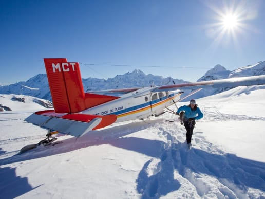 New Zealand Backcountry Skiing & Split-boarding - New Zealand's Best Glacier Touring & Ski Mountaineering - Ski Mount Cook & Westland Glaciers - Unloading a ski plane on the Tasman Glacier - Unloading a ski plane on the Tasman Glacier, glacier ski touring, Aoraki Mount Cook National Park 8
