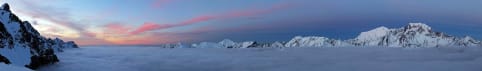 Mount Sefton - "Alpine" option - A snowy, mountainous landscape is visible in the foreground, with a vibrant, colorful sky in the background, creating a stunning and serene winter scene. 1
