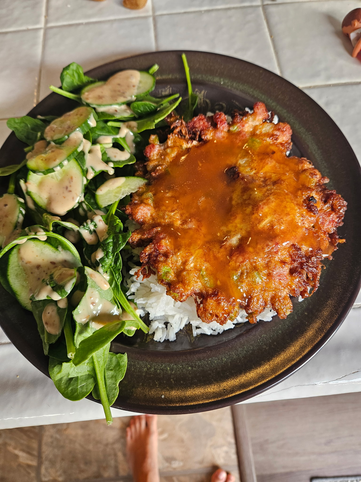 An image of eggs fu-yung with a side of salad.