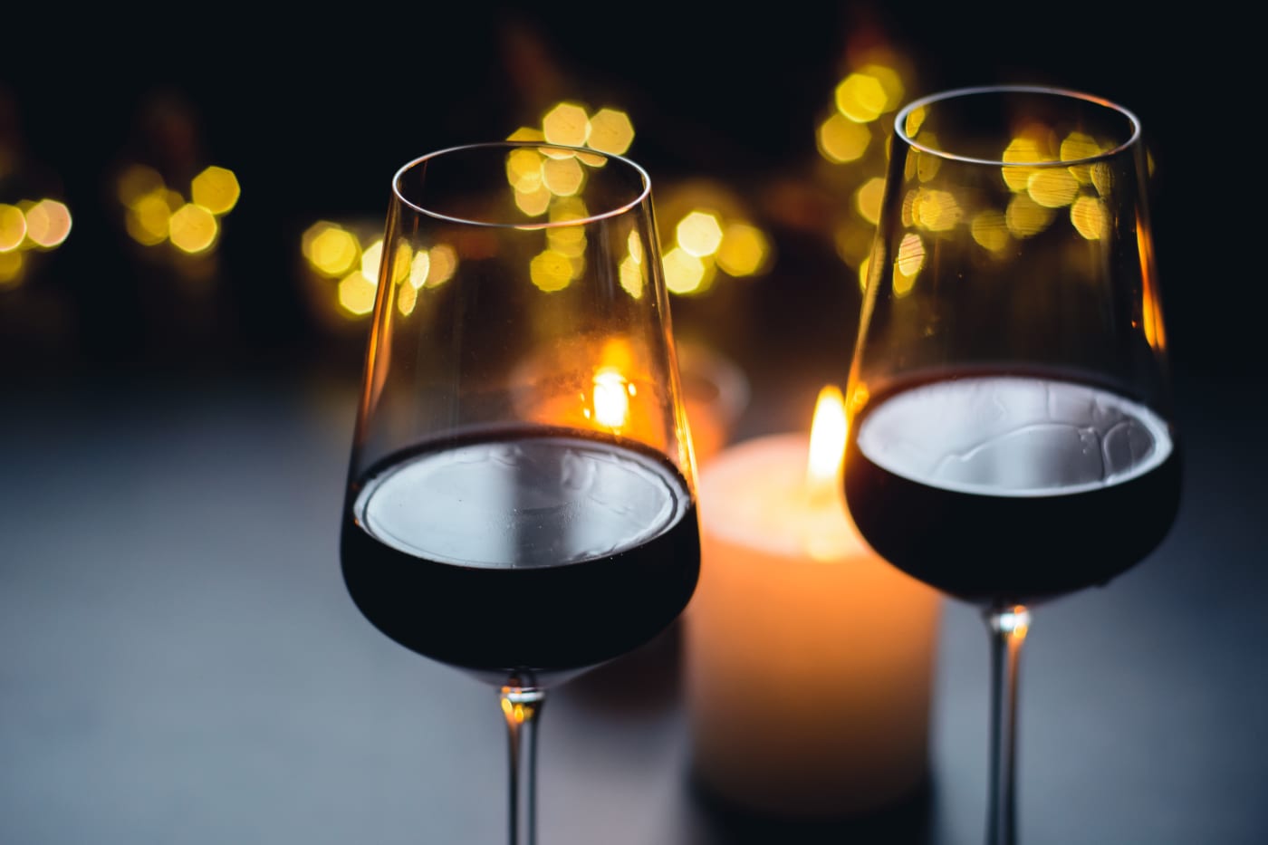 Glass of natural wine on a dark table