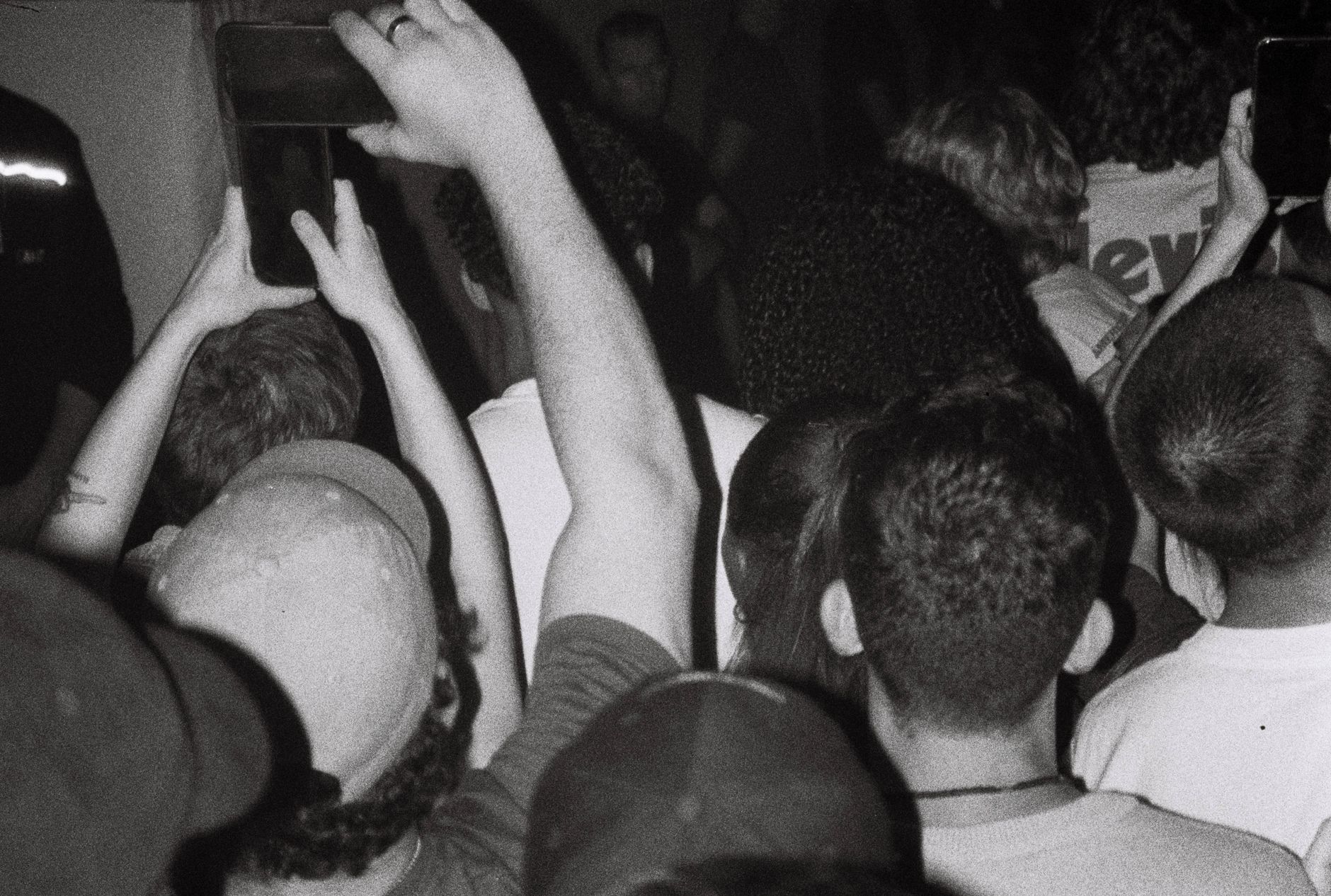 A lively crowd at a concert capturing the moment with phones in Anvers, Belgium.